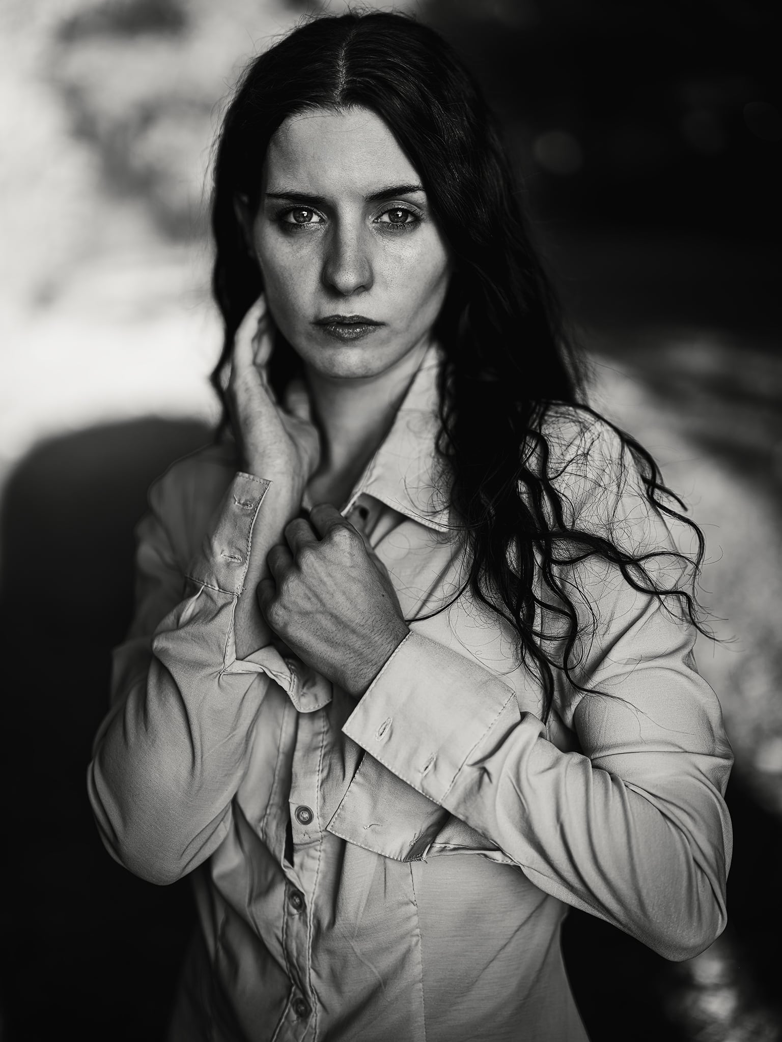 Conceptual studio portraiture with dramatic chiaroscuro lighting