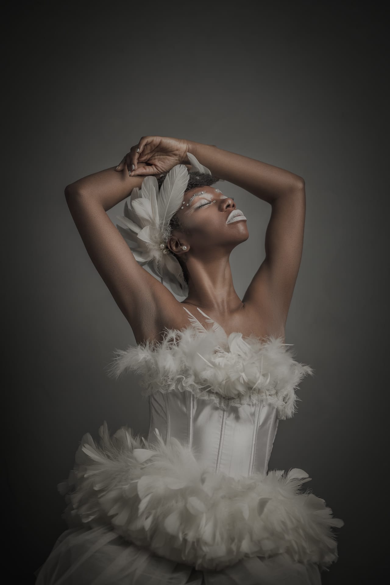 Black and white fashion portrait with elegant pose, cinematic lighting, and restrained styling