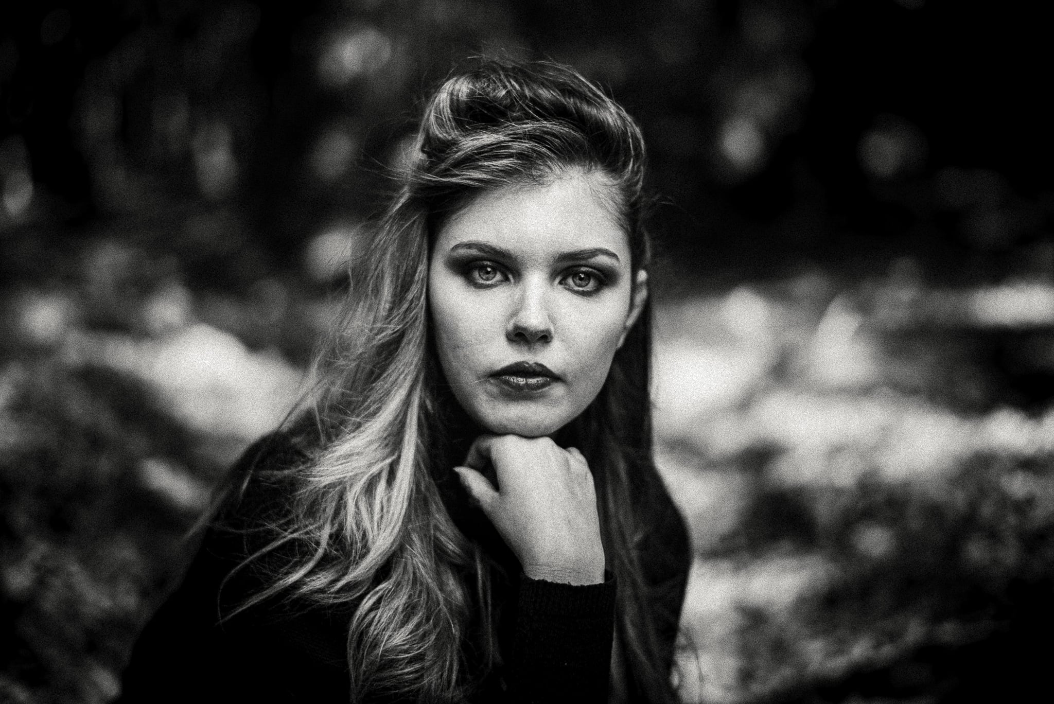 Conceptual studio portrait using dramatic light and shadow to create a refined fashion image