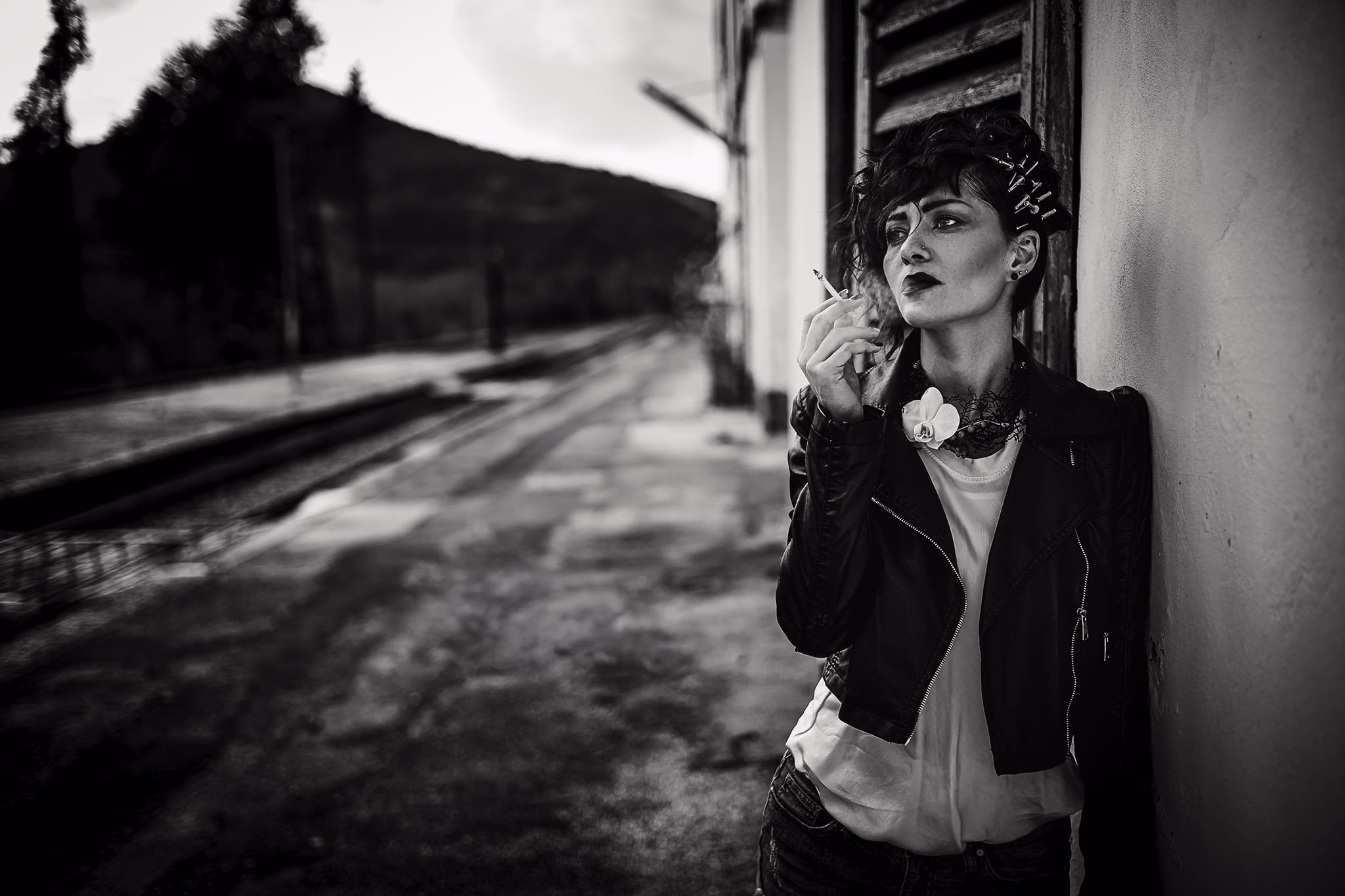 Monochrome fashion portrait with soft contrast, minimal styling, and understated elegance