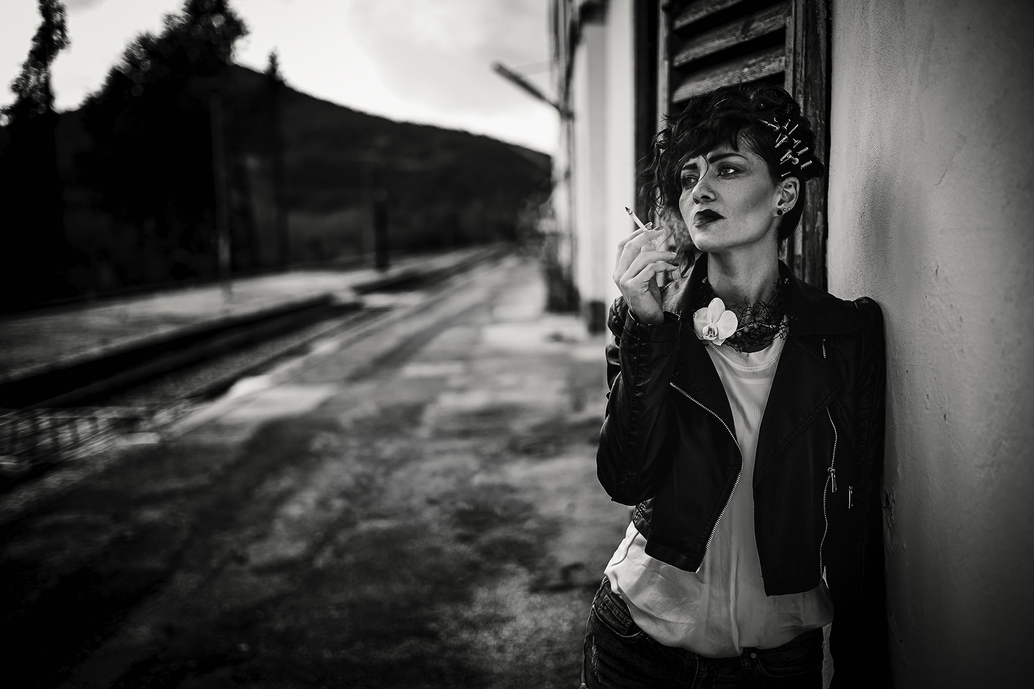 Monochrome fashion portrait with soft contrast, minimal styling, and understated elegance